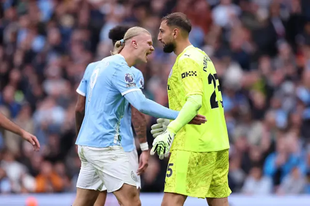 Gianluigi Donnarumma of Manchester City is congratulated by Erling Haaland