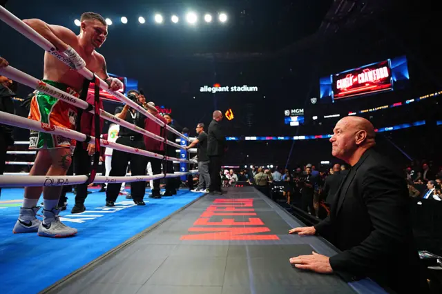 Callum Walsh leans over the ropes to speak to Dana White