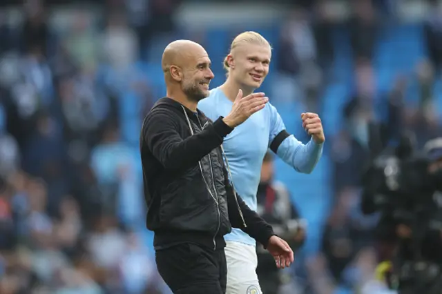 Pep Guardiola and Erling Haaland of Manchester City celebrate
