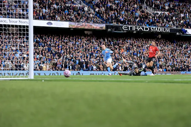 Erling Haaland of Manchester City scores the third goal