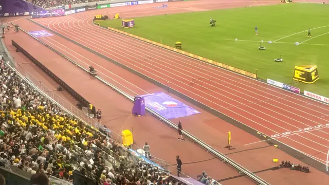 A group of Jamaica fans sit by the finish line