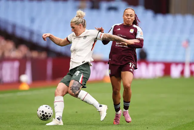 Millie Bright of Chelsea is challenged by Ebony Salmon of Aston Villa during the Barclays Women's Super League match between Aston Villa and Chelsea FC at Villa Park on September 14, 2025 in Birmingham, England