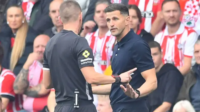 Portsmouth manager John Mousinho remonstrates with the officials