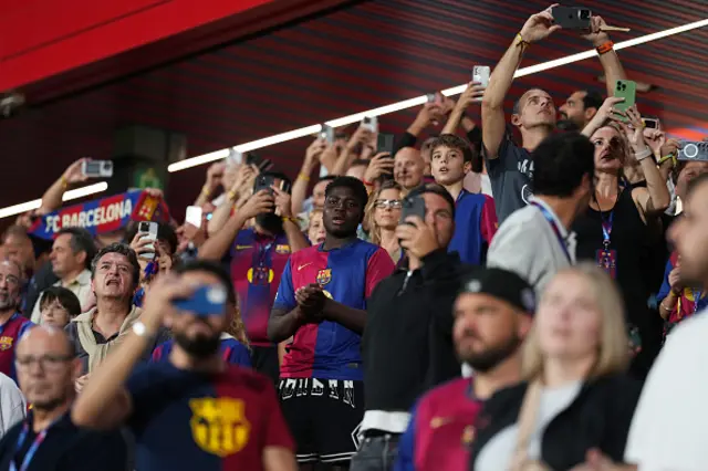 Fans of FC Barcelona cheer