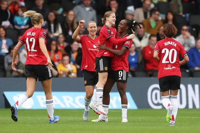 Jess Park of Manchester United celebrates scoring her team's fifth goal with teammates during the Barclays Women's Super League match between London City Lionesses and Manchester United at Copperjax Community Stadium on September 14, 2025 in Bromley, England.