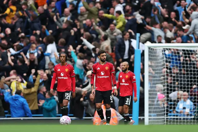 Leny Yoro and Bruno Fernandes of Manchester United react