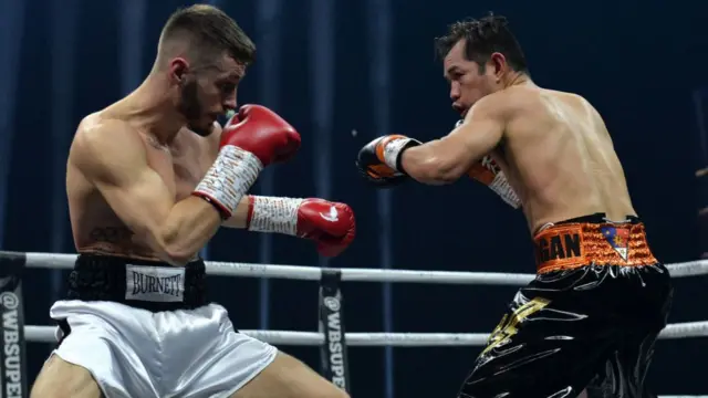 Ryan Burnett of Northern Ireland (white shorts), takes on Nonito Donaire of Philippines (black Shorts.