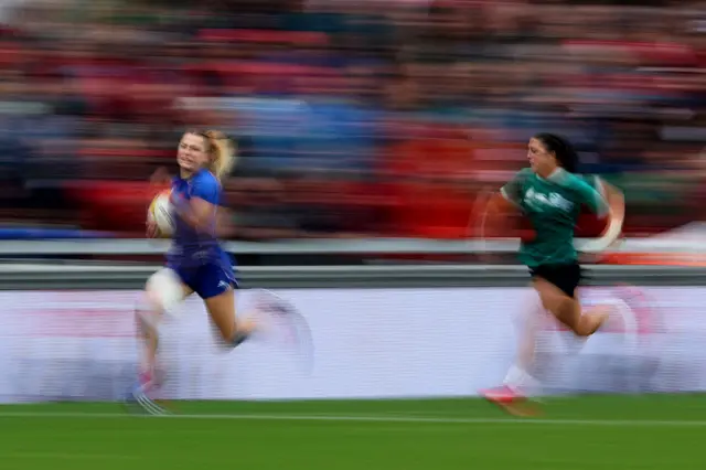 France's wing Joanna Grisez runs to score a try during the Women's Rugby World Cup quarter-final between France and Ireland
