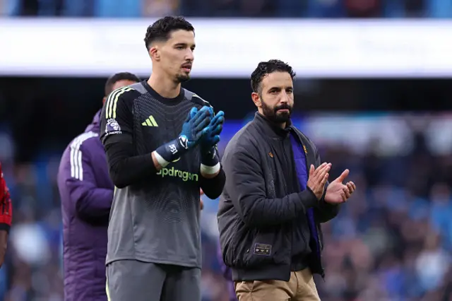 Ruben Amorim, manager of Manchester United and Altay Bayindir applaud their support