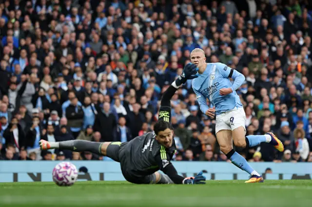 Erling Haaland of Manchester City scores his team's third goal