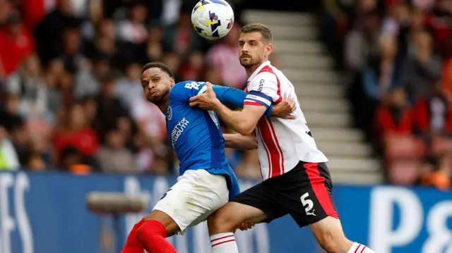 Josh Murphy battles with Southampton's Jack Stephens