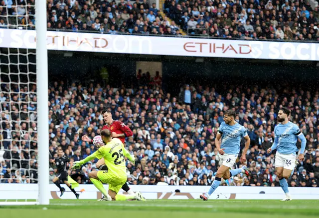 Gianluigi Donnarumma of Manchester City makes a save from Benjamin Sesko