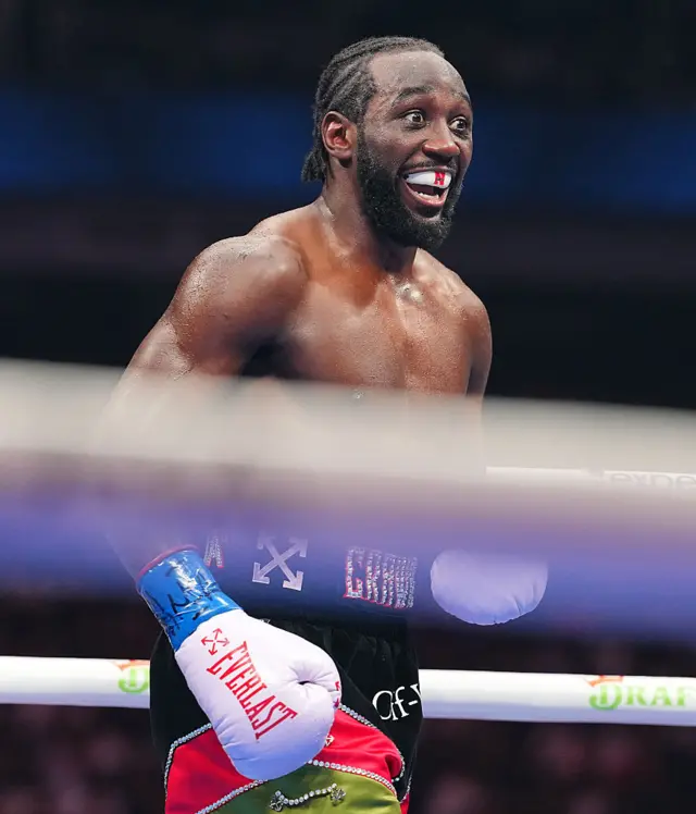 Terence Crawford smiles in the ring