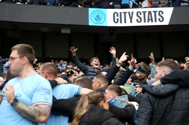Manchester City fans celebrate after Erling Haaland