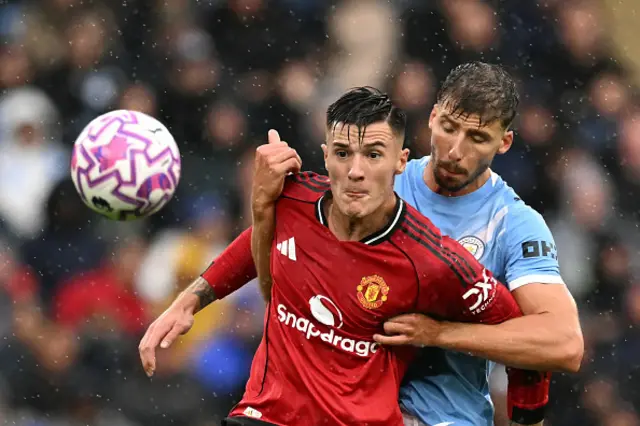 Benjamin Sesko (front) tries to take the ball