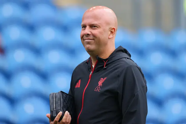 Arne Slot, head coach of Liverpool looks on