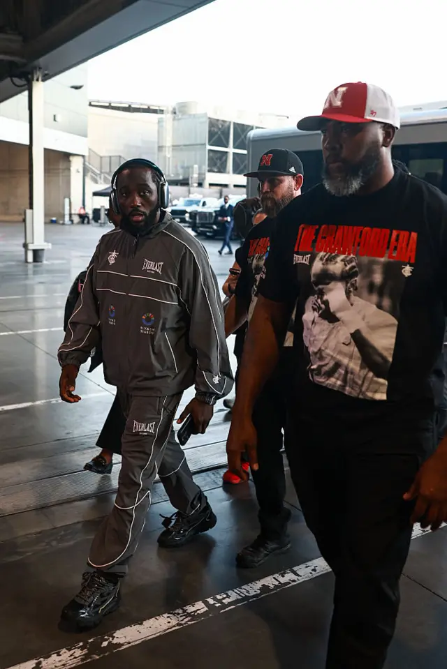 Terence Crawford a grey tracksuit arrives