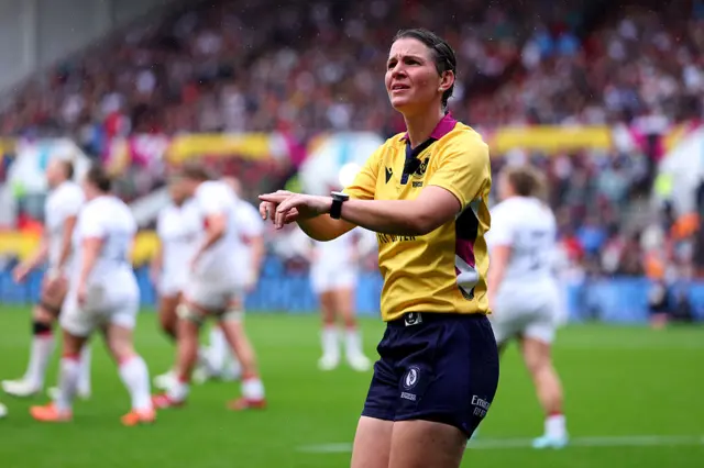 Referee doing the TMO hand signal