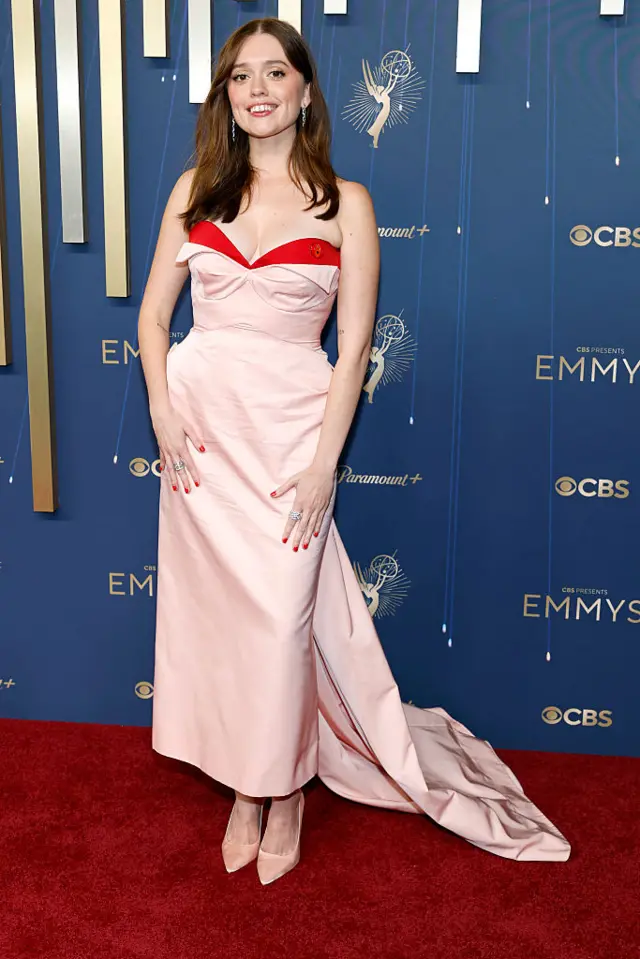 Aimee Lou Wood wears a pink strapless dress on the red carpet