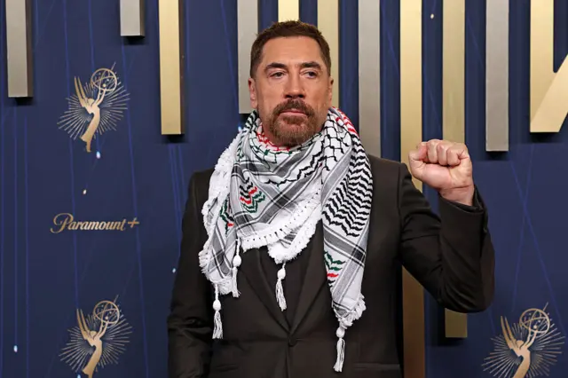 Javier Bardem holds up a fist