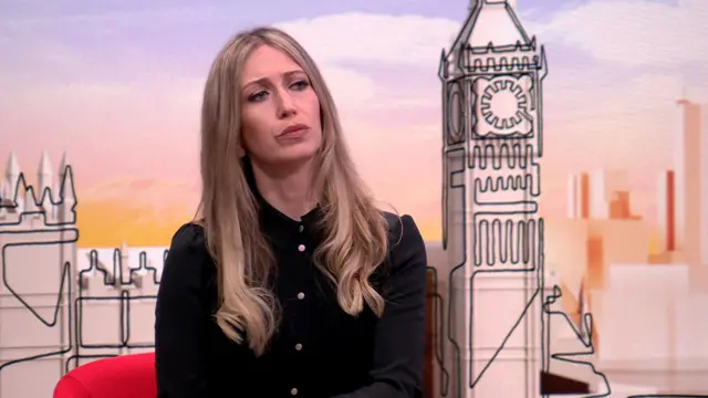 Shadow Education Minister Laura Trott sitting on a red armchair in a black dress, a graphic of the Big Ben and the Houses of Parliament behind her