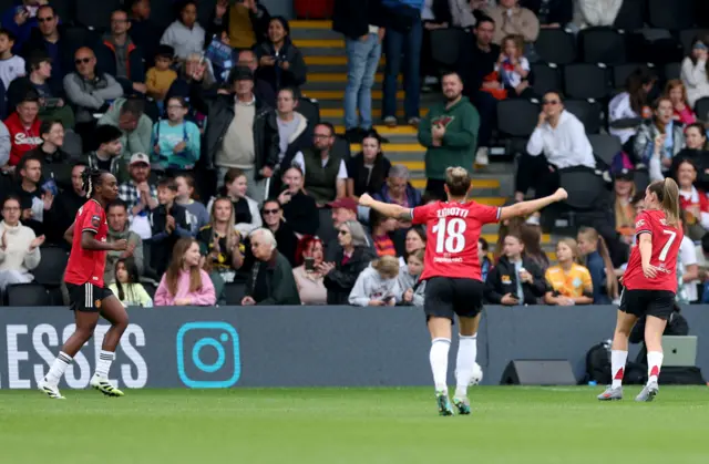Manchester United's Melvine Malard (left) celebrates after scoring her sides third goal