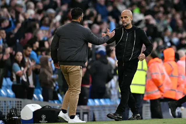 Ruben Amorim (L) shakes hands with Manchester City's Spanish manager Pep Guardiola