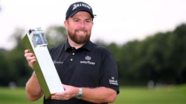 Shane Lowry holds the trophy