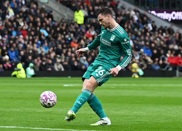 Andrew Robertson of Liverpool passes the ball