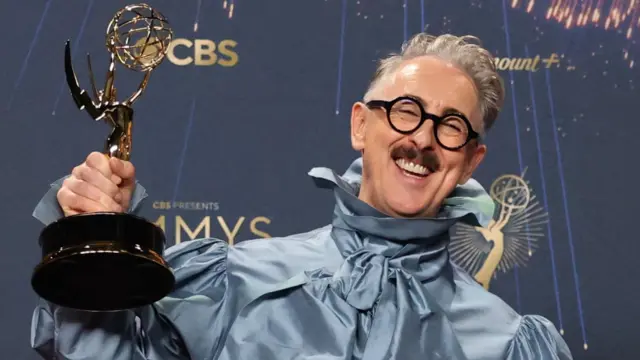 Alan Cumming poses with the award for Outstanding Reality Competition Program for "The Traitors" at the 77th Primetime Emmy Awards in Los Angeles