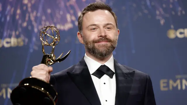 British director and producer Philip Barantini, winner of the award for outstanding directing for a limited or anthology series or movie for 'Adolescence,' poses with their award in the press room