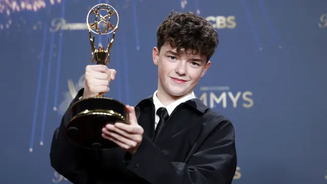 English actor Owen Cooper holds the award for Outstanding Supporting Actor in a Limited or Anthology Series or Movie for 'Adolescence', in the press room during the 77th annual Emmy Awards ceremony held at the Peacock Theater in Los Angeles, California