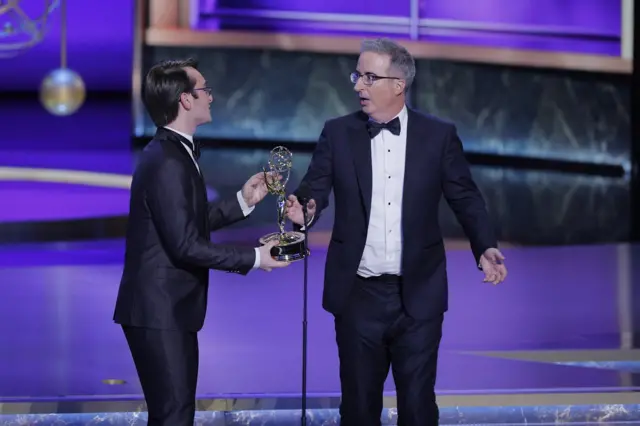John Oliver reacts after winning the award for Outstanding Scripted Variety Series
