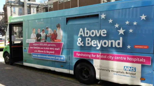A blue branded University Hospitals Bristol and Weston NHS Foundation Trust. It is wrapped in blue branded graphics.