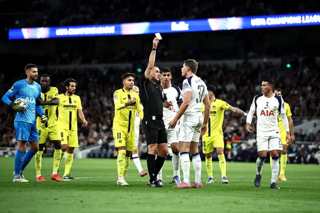 Tottenham Hotspur's Dutch defender #37 Micky van de Ven is shown a yellow card by Referee Rade Obrenovic during the UEFA Champions League football league stage match between Tottenham Hotspur and Villarreal at the Tottenham Hotspur Stadium in London, on September 16, 2025.