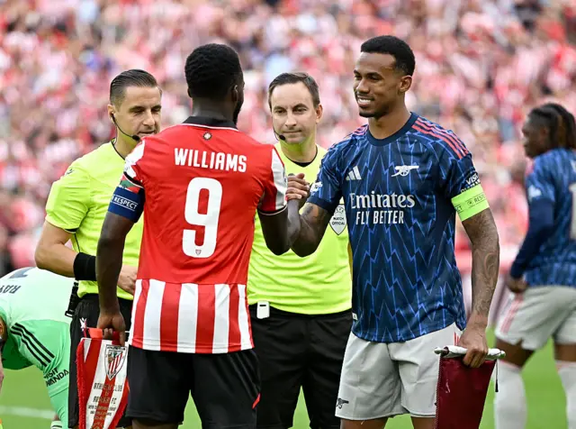 Athletic Bilbao's Ghanaian forward #09 Inaki Williams (L) greets Arsenal's Brazilian defender #06 Gabriel at the start of the UEFA Champions League first round day 1 football match between Athletic Club Bilbao and Arsenal