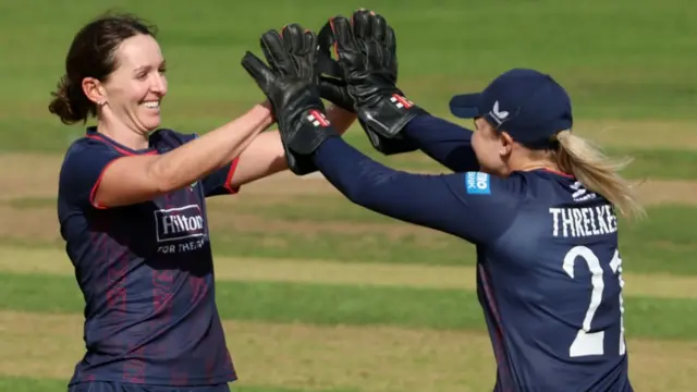 Kate Cross takes a wicket