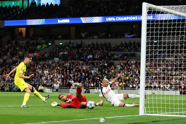 Luis Junior of Villarreal scores an own goal under pressure from Richarlison of Tottenham Hotspur