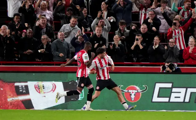 Aaron Hickey celebrates