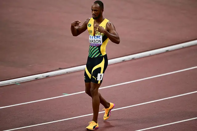 Jamaica's athlete Tyler Mason reacts