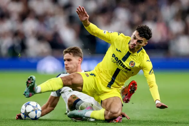 Micky van de Ven of Tottenham (L) in action against Georges Mikautadze of Villarreal