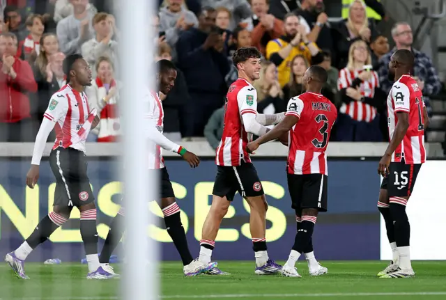 Aaron Hickey celebrates