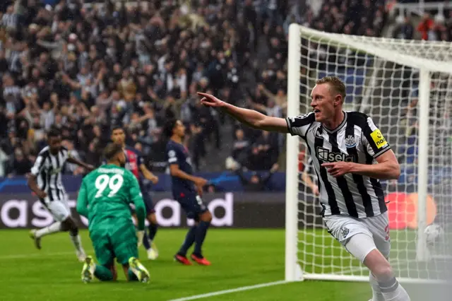 Sean Longstaff celebrates scoring for Newcastle against Paris St-Germain