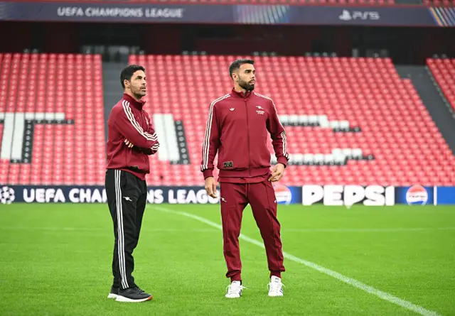 Mikel Arteta and David Raya