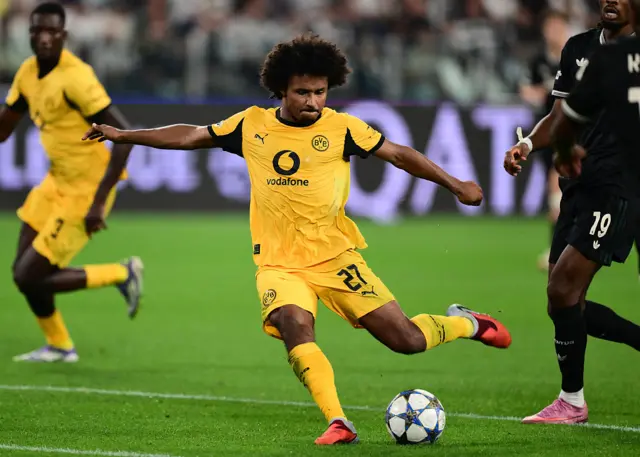 Dortmund's German forward #27 Karim Adeyemi scores his team's first goal