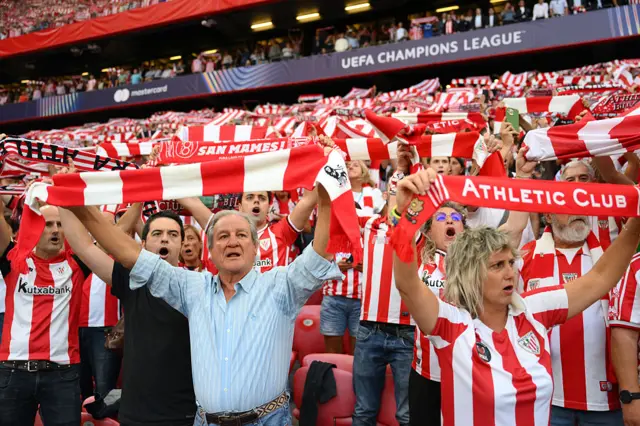 Fans of Athletic Club are seen holding up scarves prior to the UEFA Champions League 2025/26 League Phase MD1 match between Athletic Club and Arsenal FC at Estadio de San Mames on September 16, 2025 in Bilbao, Spain.