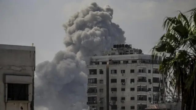 Cloud of smoke over run-down residential building