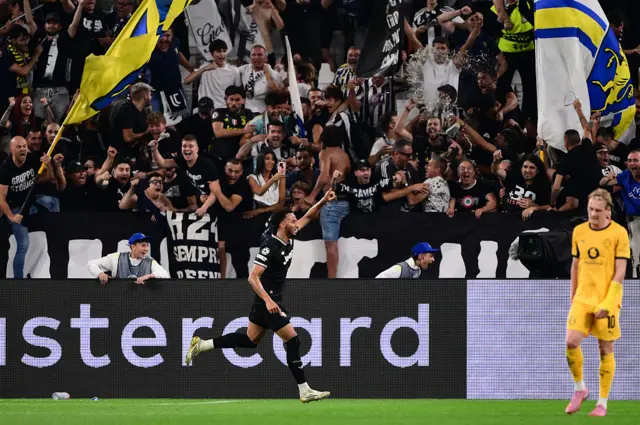 Juventus' English defender #06 Lloyd Kelly celebrates scoring his team's fourth goal during the UEFA Champions League first round day 1 football match between Juventus and Borussia Dortmund at the Allianz stadium in Turin, northern Italy, on September 16, 2025.