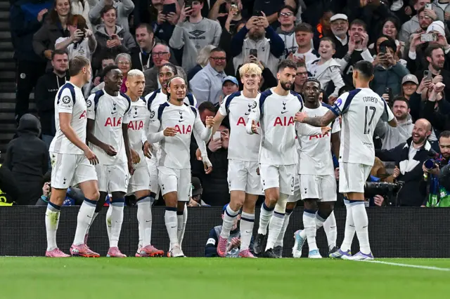 The Tottenham Hotspur players celebrate after scoring the 1-0 goal
