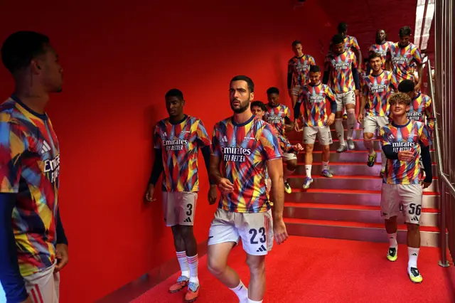 Cristhian Mosquera and Mikel Merino of Arsenal react as they walk out to warm up prior to the UEFA Champions League 2025/26 League Phase MD1 match between Athletic Club and Arsenal FC at Estadio de San Mames on September 16, 2025 in Bilbao, Spain.